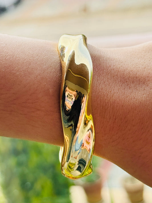 Gleaming Gold Wavy statement Bangle